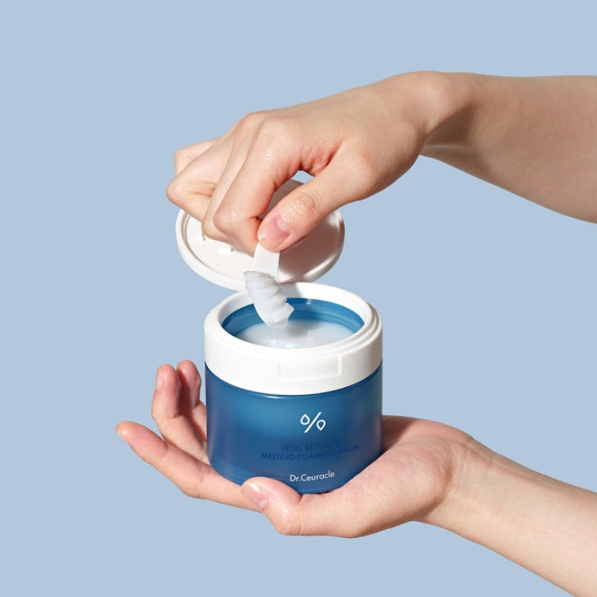 Dr.Ceuracle Hyal Reyouth Melting Foaming Balm 100ml jar opened by hand