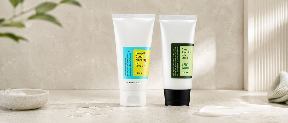COSRX low pH cleanser and Aloe Soothing Sun Cream arranged on a bright skincare vanity