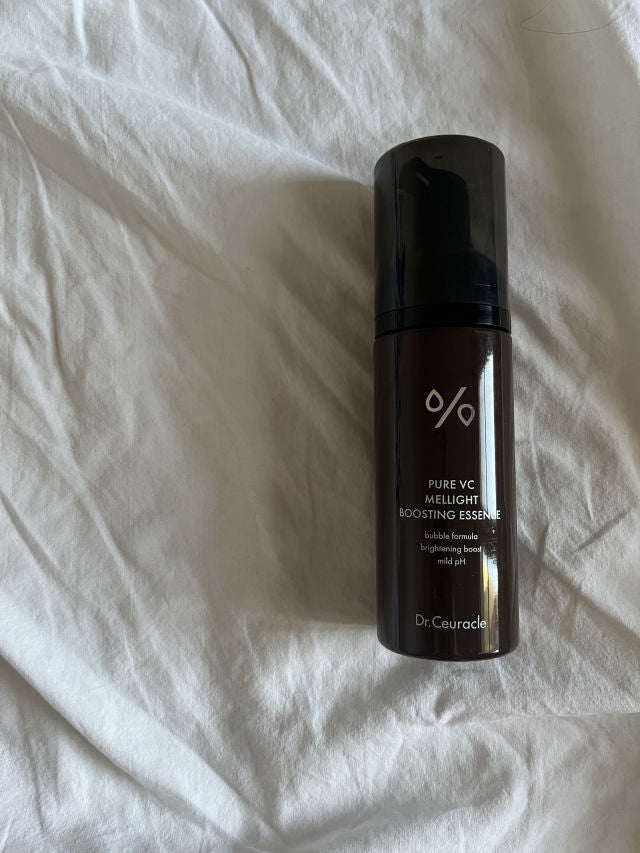 Dr.Ceuracle Pure VC Mellight Boosting Essence 145ml bottle photographed on fabric